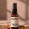 Youthful Glo Night Renewal Serum in an amber glass bottle with frankincense and rosemary