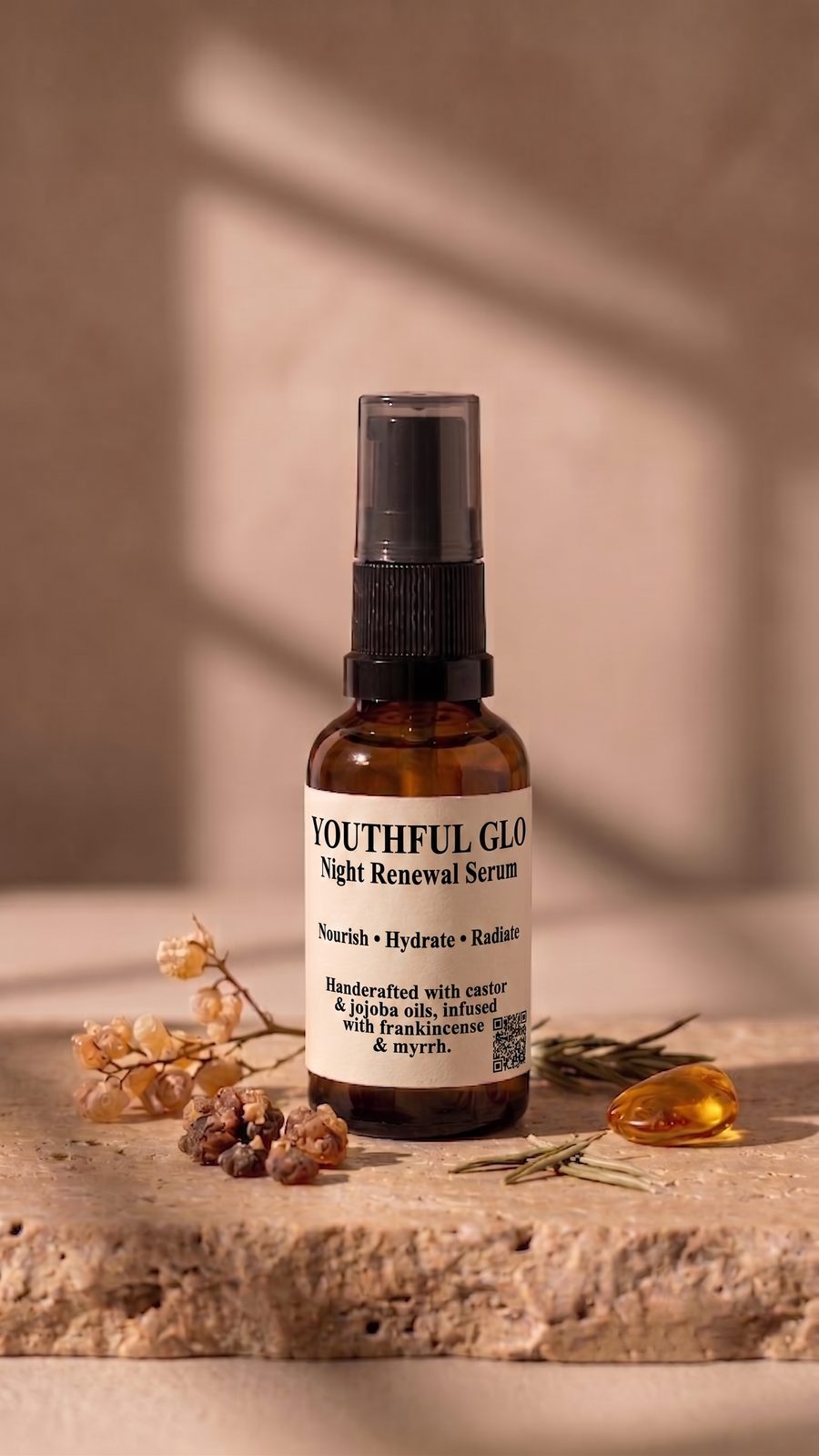Youthful Glo Night Renewal Serum in an amber glass bottle with frankincense and rosemary